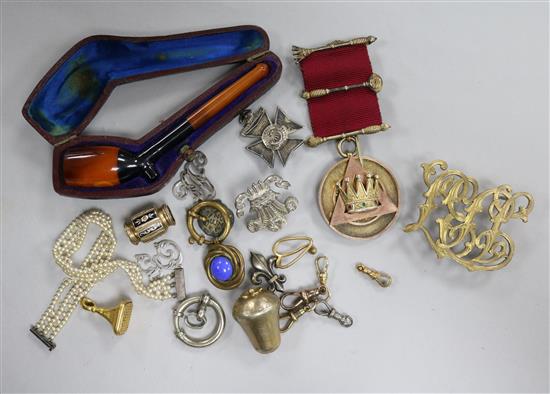 A silver gilt medallion, cased pipe and other items.